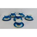 A Stanley fine bone china tea set, the blue glazed porcelain with red polka dot pattern and gilt