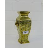 A Chinese brass vase with mythical beast mask head handles to side and engraved decoration, 20cm