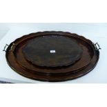 A group of three mahogany trays to include two with brass handles, largest 80 x 54cm, (3)