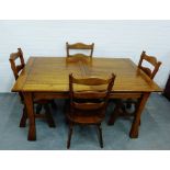 An oak dining suite comprising four ladder back chairs and an extending table, 46 x 99cm