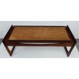 1970's teak framed coffee table with inset rectangular panel to top engraved with a series of