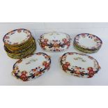 A 19th century Staffordshire ironstone dinner service with Imari coloured floral borders