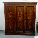 A 19th century Dutch marquetry, abalone and mahogany wardrobe, the cornice top over three doors