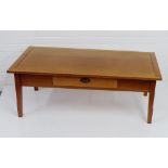 A contemporary hardwood coffee table with single frieze drawer coffee table, 46 x 122cm