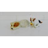 A Royal Doulton porcelain figure of a small dog chasing a ball, together with a Beswick dog, (2)