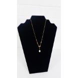 9 carat gold necklace with faux pearl drop