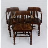 Set of three oak smokers / captains chairs with carved top rails and spindle backs, over solid