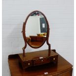 A mahogany dressing table mirror with oval swing mirror over a breakfront base with drawer, 66 x