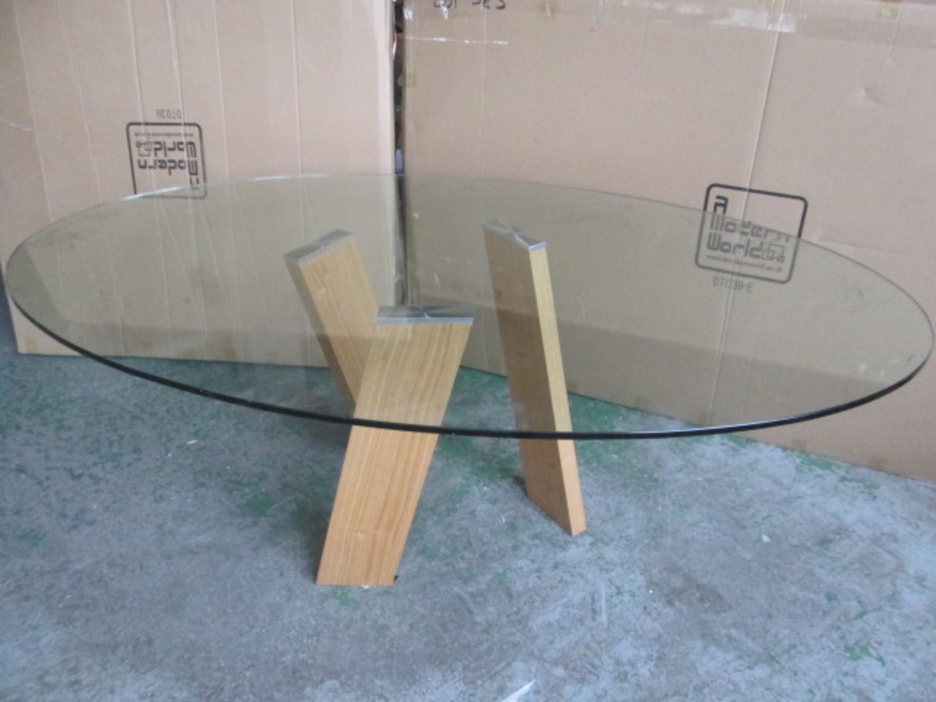 Boxed/As New: Levitat Dining Table with Wood Legs & Glass Oval Top. Size (H) 75cm x (W) 204 x (D)