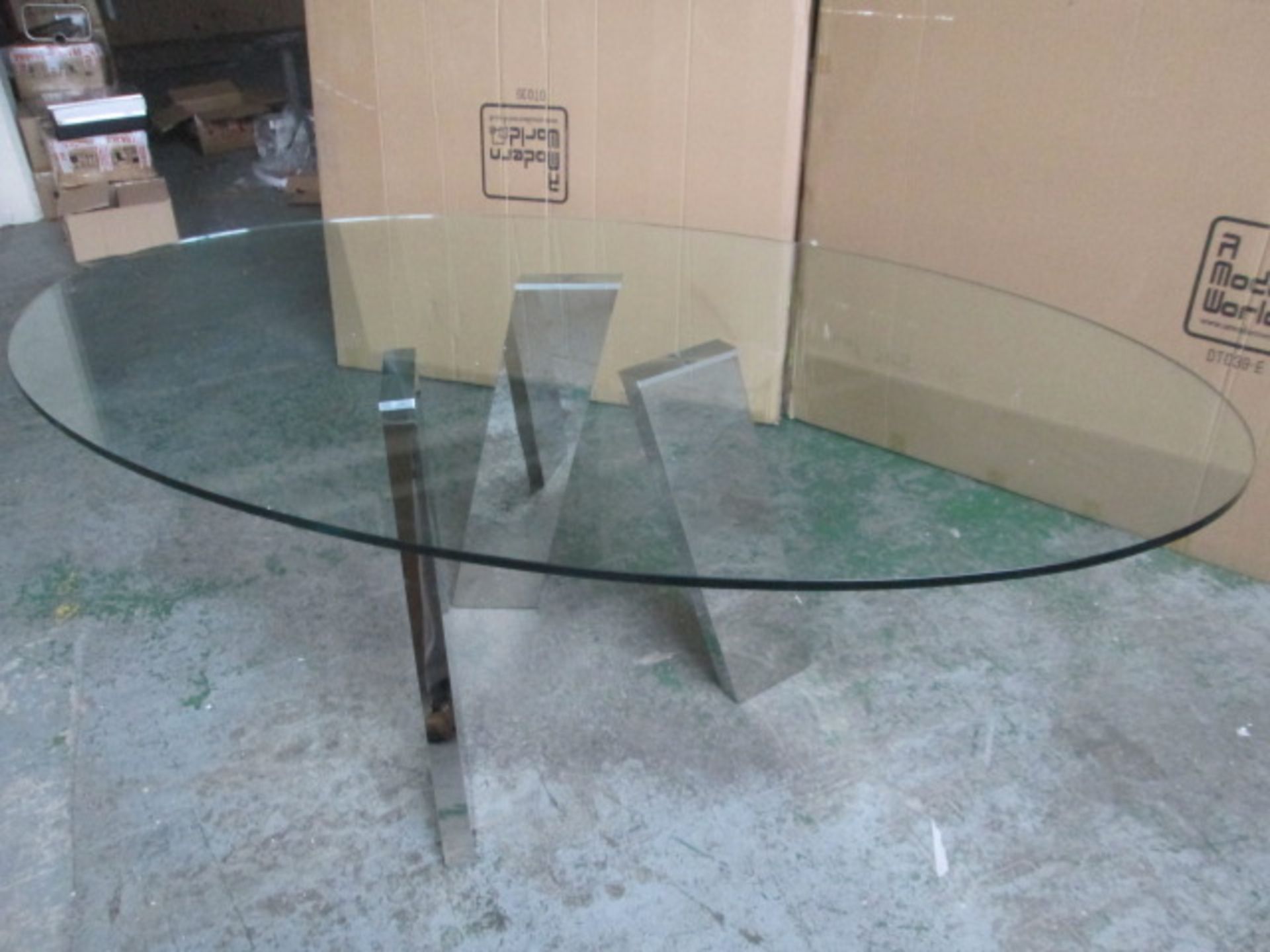 Ex Display: Levitat Dining Table with Polished Stainless Steel Legs & Glass Oval Top. Size (H)