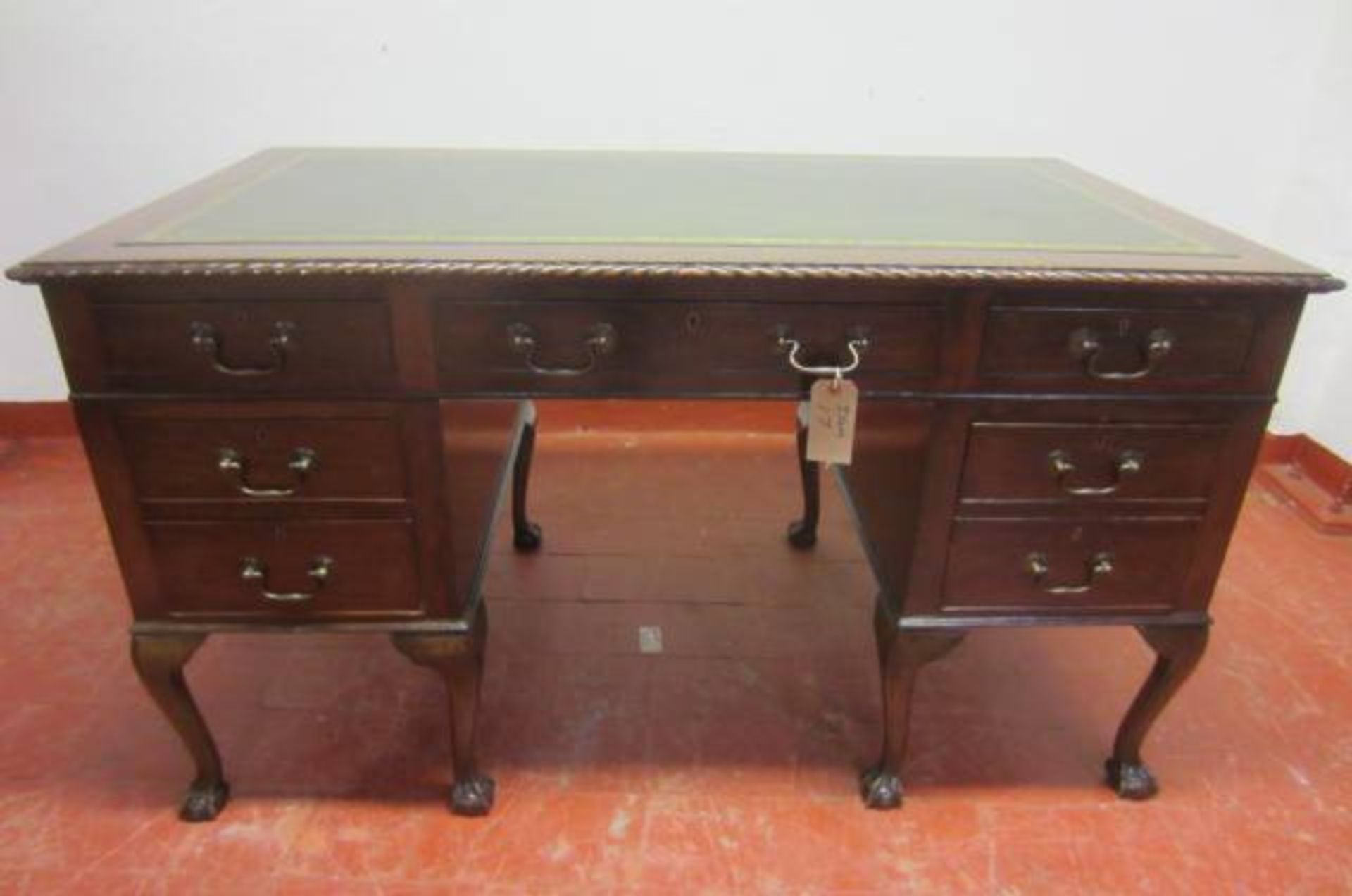 An Edwardian Mahogany, Double Pedestal Desk with 7 Drawers & Leather Insert Top on Ball & Claw Feet.