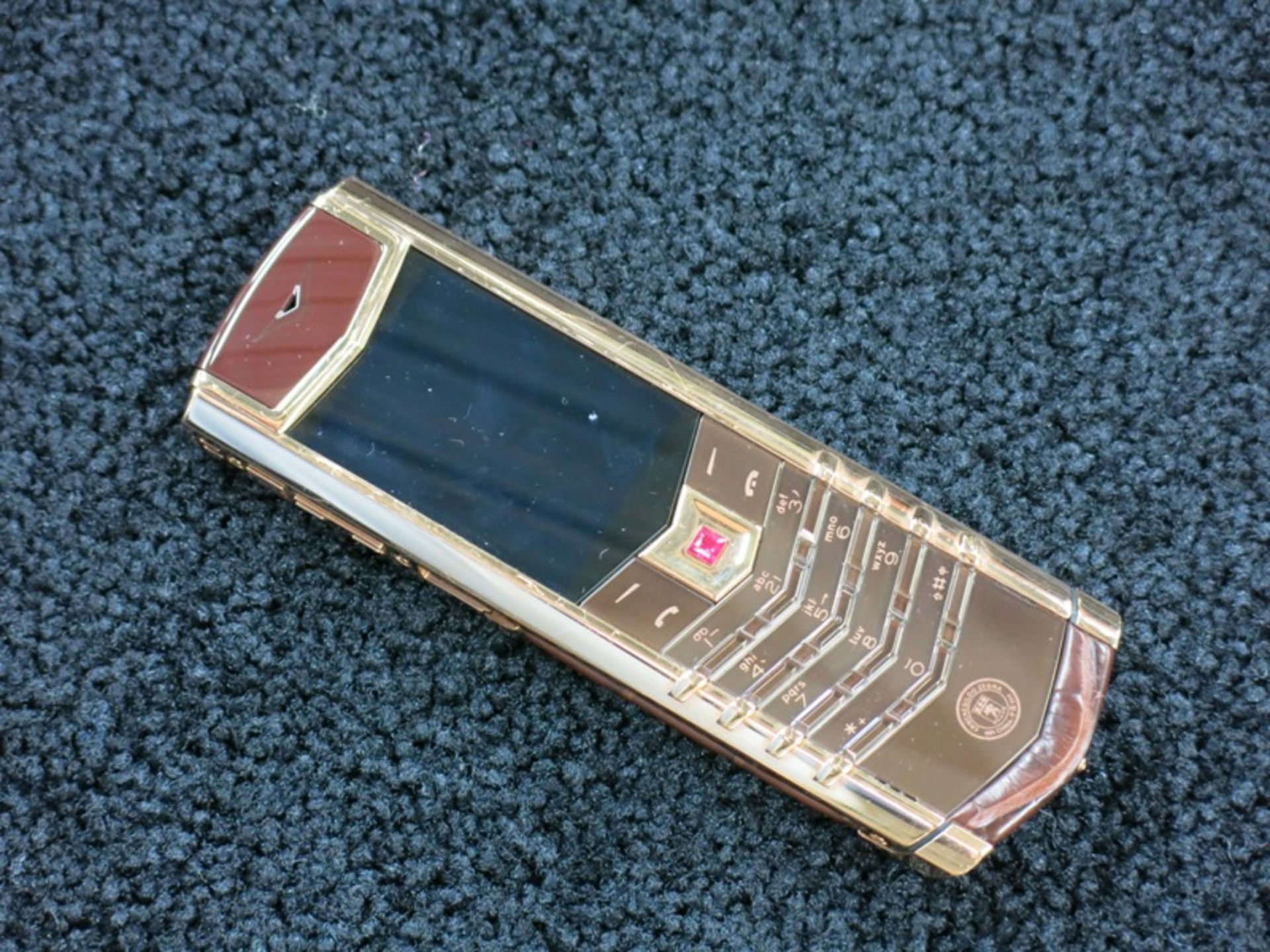 Vertu 18kt Red Gold Signature S Phone with Ruby Select Key. Furnished with Ceramic Pillow,
