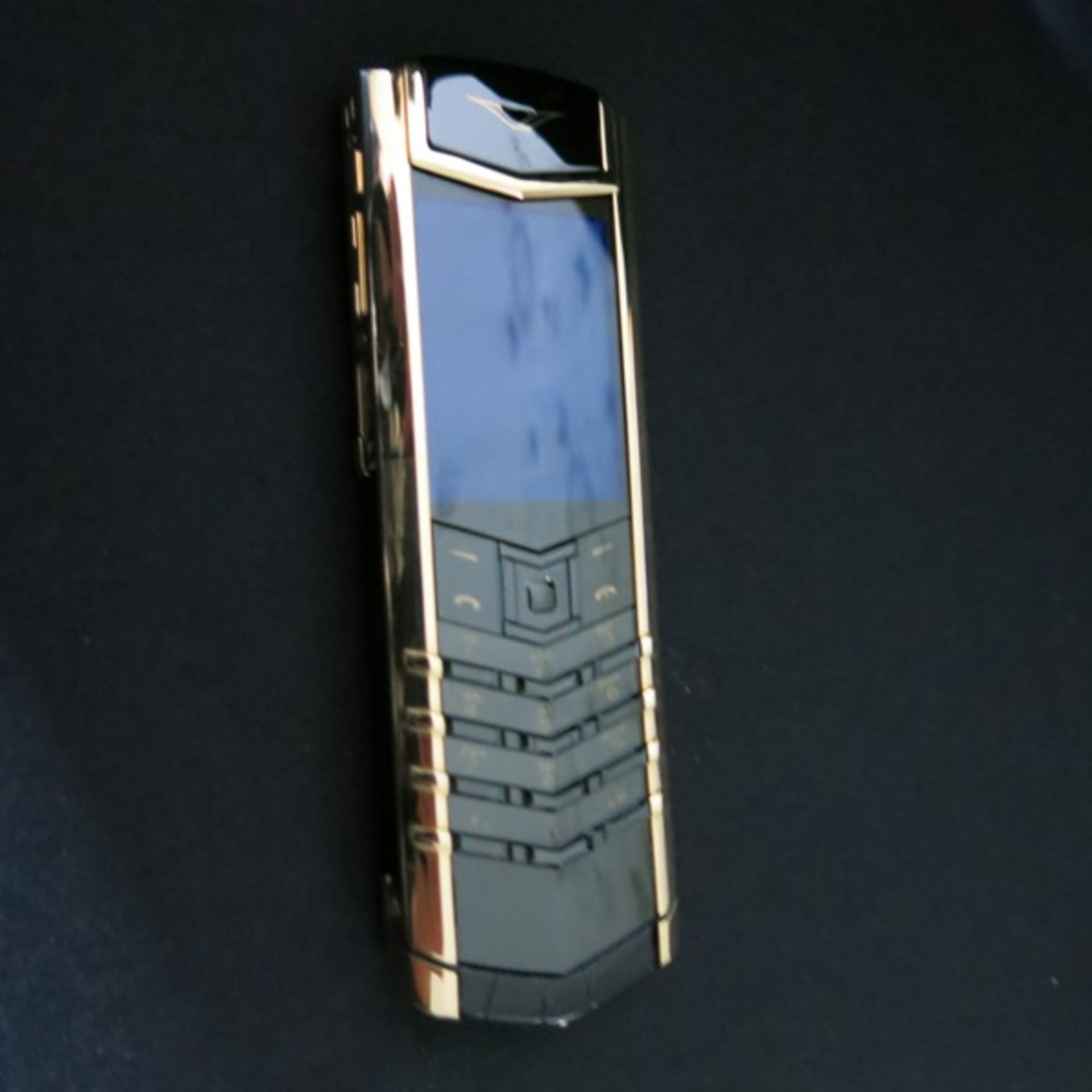 Vertu 18kt Yellow Gold Signature S Phone. Furnished with Black Alligator Leather, Ceramic Pillow,