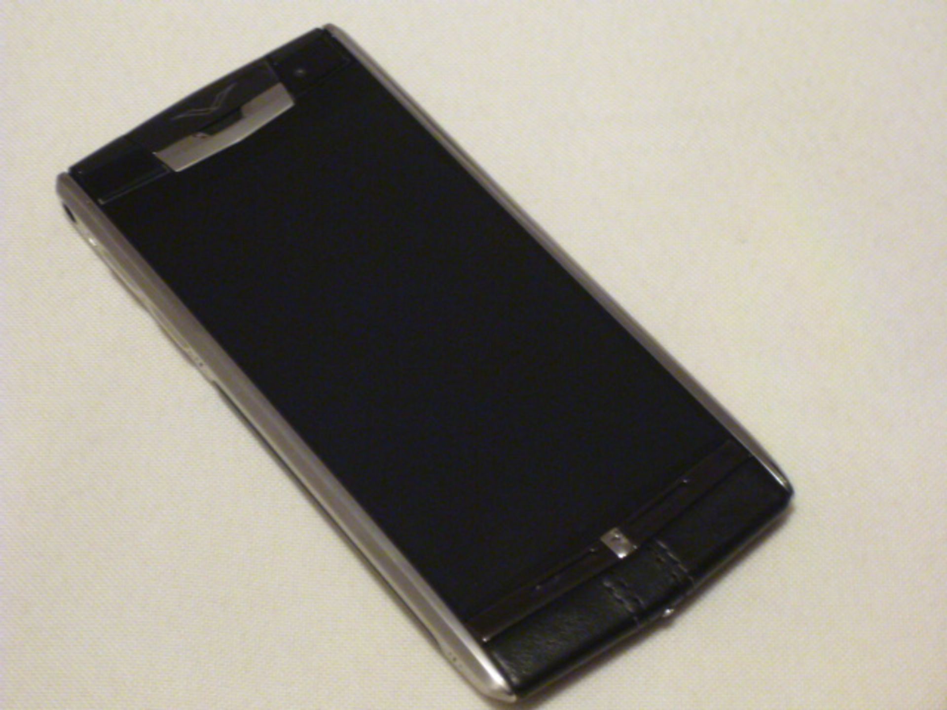 Vertu Signature Touch Phone, Jet Calf Black Stitched Leather "Courtesy Phone". S/n E-013652. Comes