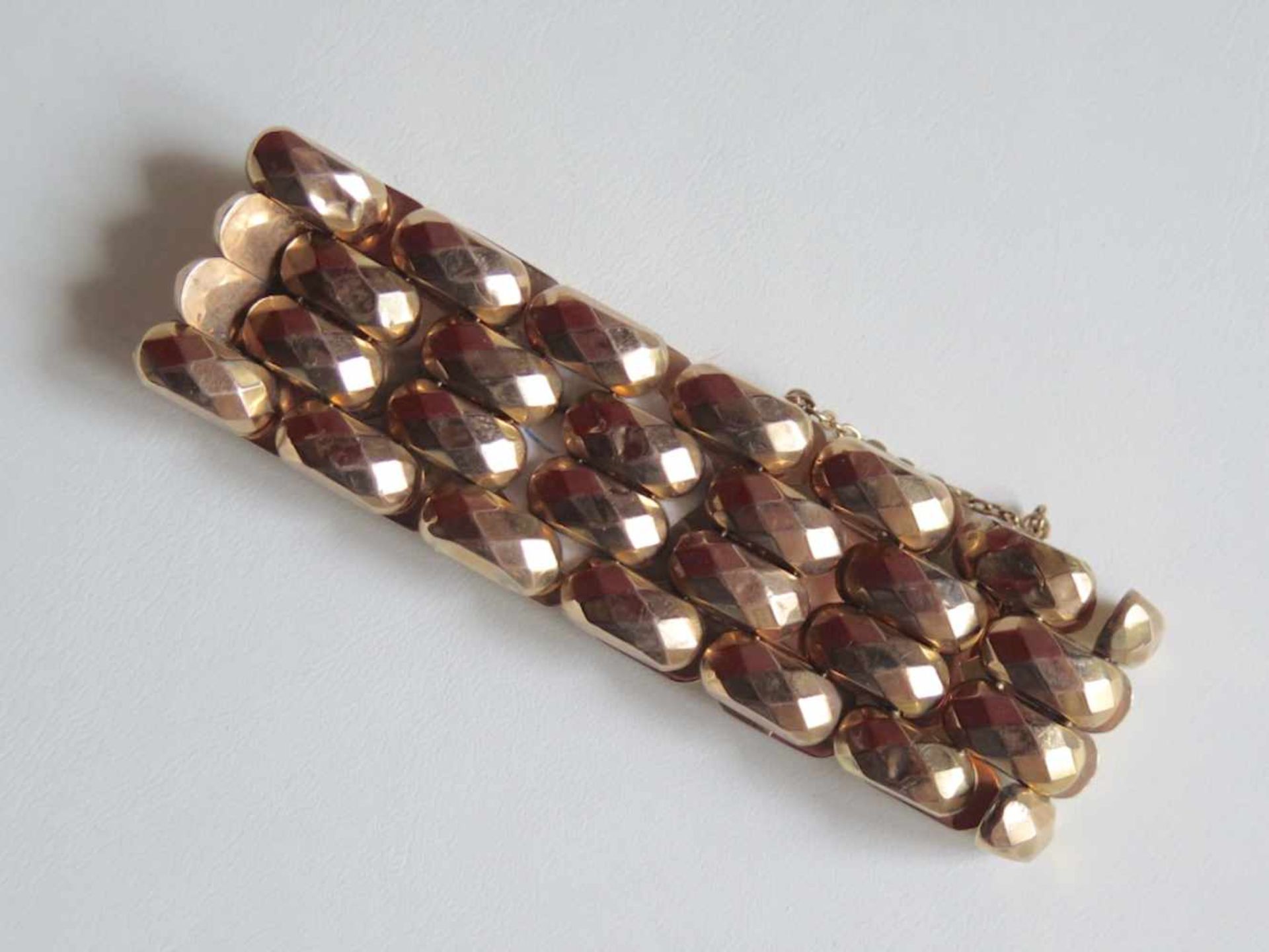 Bracelet en or rose 750, mailles souples (bosses et usures). Avec chaînette de sécurité. Longueur: