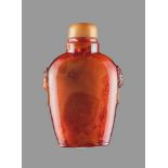 A ROOT AMBER SNUFF BOTTLE, QING DYNASTY Root amber of deep and characteristic brown tone with