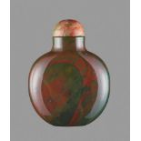 A JASPER SNUFF BOTTLE, QING DYNASTY Jasper (heliotrope), the untreated stone with an even and smooth