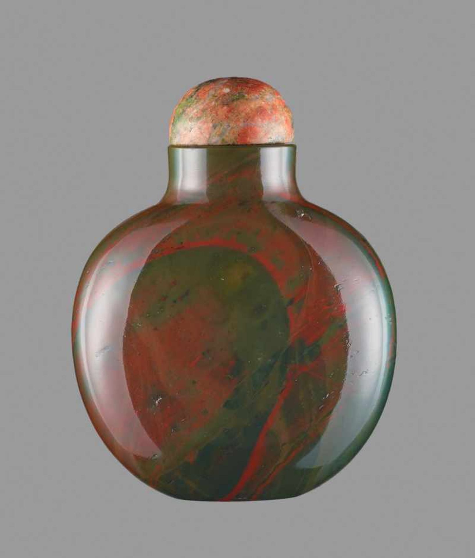 A JASPER SNUFF BOTTLE, QING DYNASTY Jasper (heliotrope), the untreated stone with an even and smooth