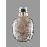 A HAIR CRYSTAL SNUFF BOTTLE, QING DYNASTY Clear crystal with inclusions of black tourmaline needles.