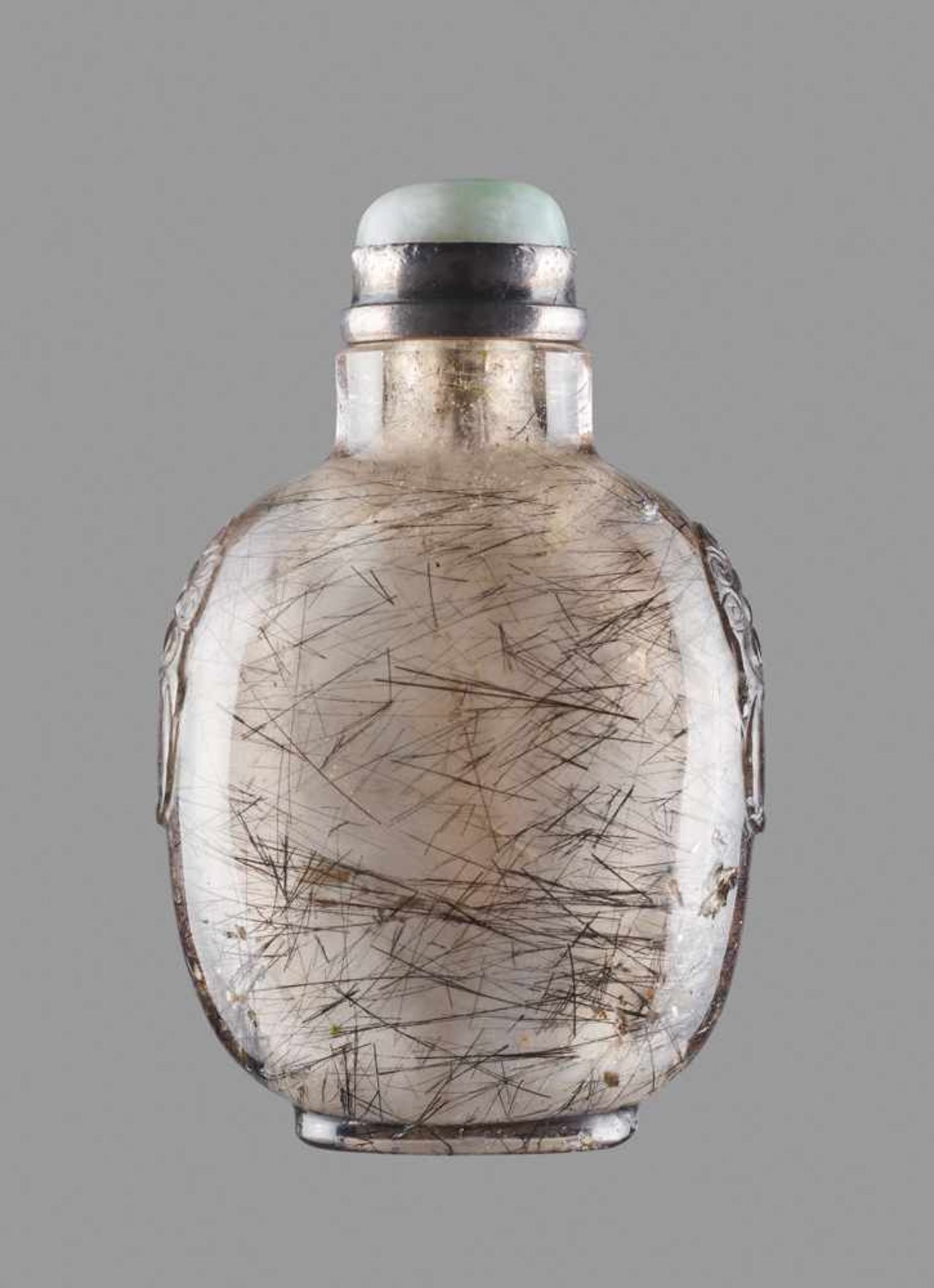 A HAIR CRYSTAL SNUFF BOTTLE, QING DYNASTY Clear crystal with inclusions of black tourmaline needles.