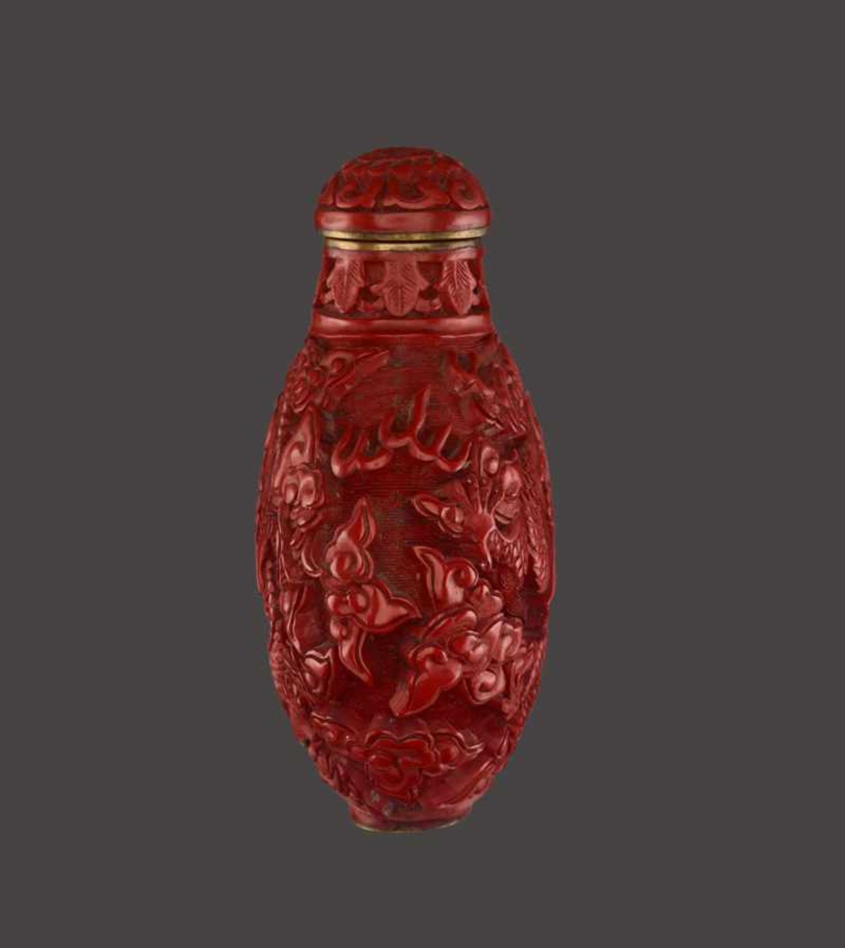 A CINNABAR LACQUER ‘DRAGON’ SNUFF BOTTLE Cinnabar lacquer in high relief on bronze body. China, late - Image 3 of 6