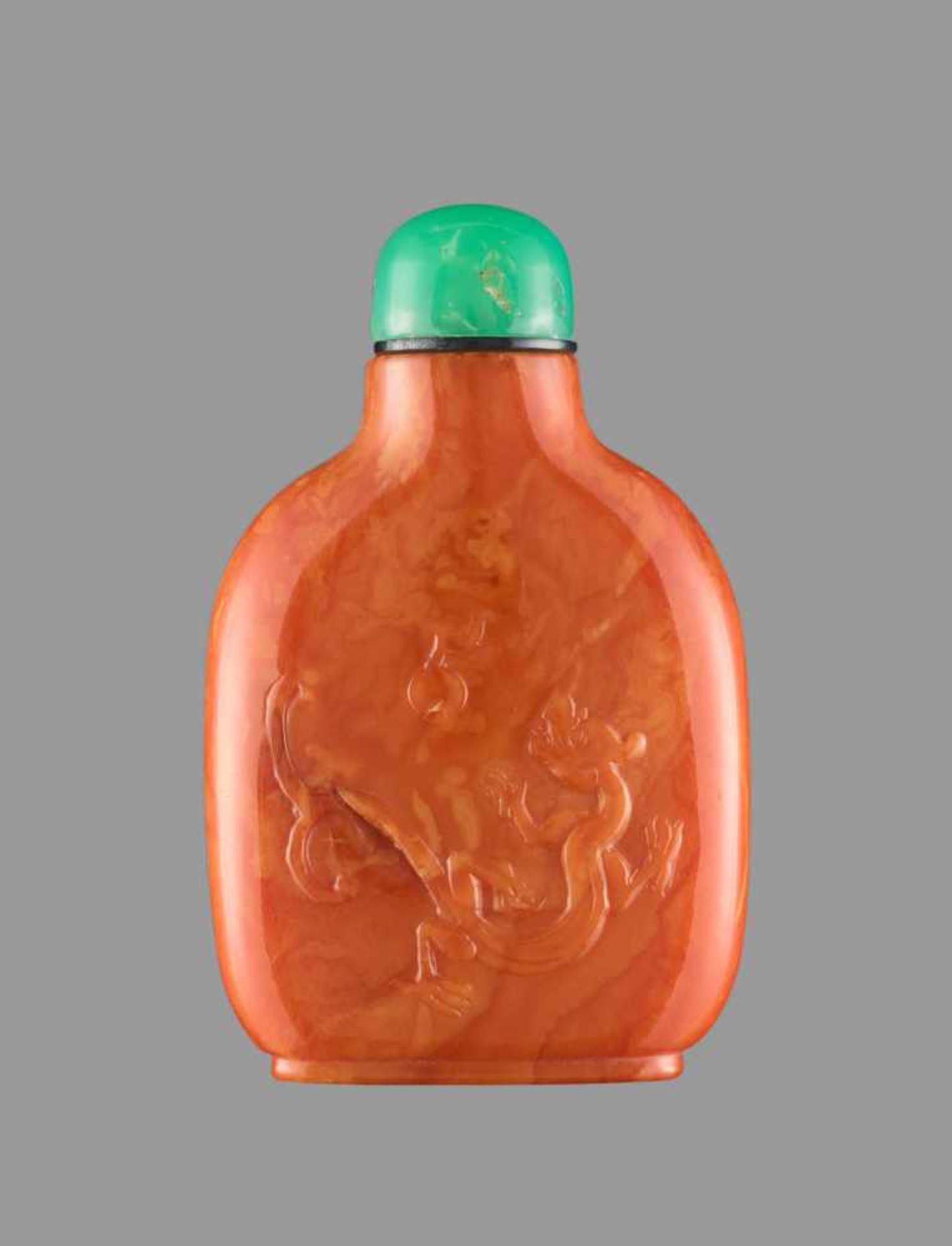 A BALTIC AMBER ‘QILONG’ SNUFF BOTTLE, QING DYNASTY Baltic amber, opaque, of intensive egg-yolk