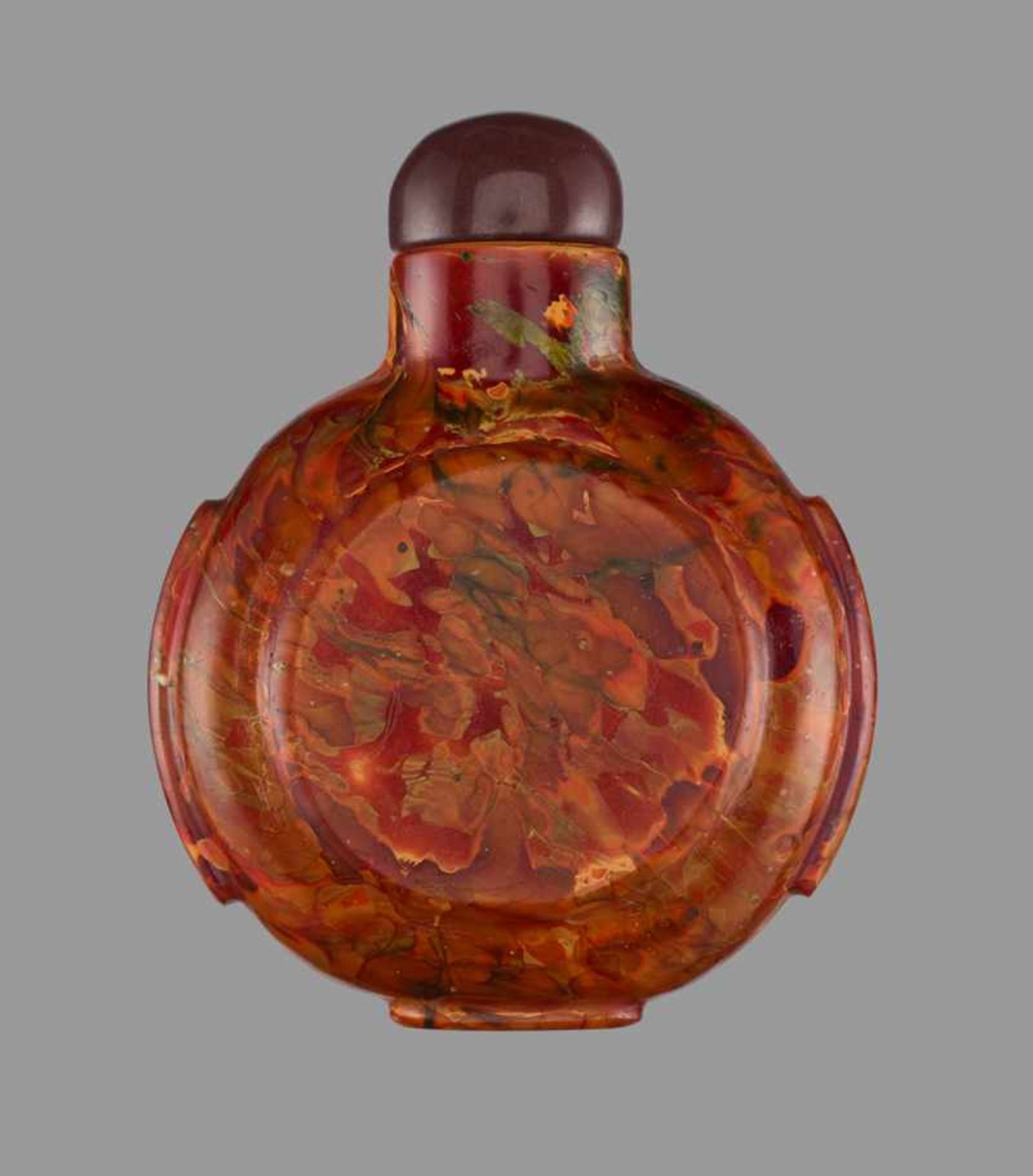 A ‘REALGAR’ GLASS SNUFF BOTTLE Opaque glass in imitation of realgar, with a color scheme typical for