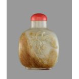 A WHITE AND RUSSET JADE ‘BAT AND PEACHES’ SNUFF BOTTLE Nephrite of even celadon color with a layer