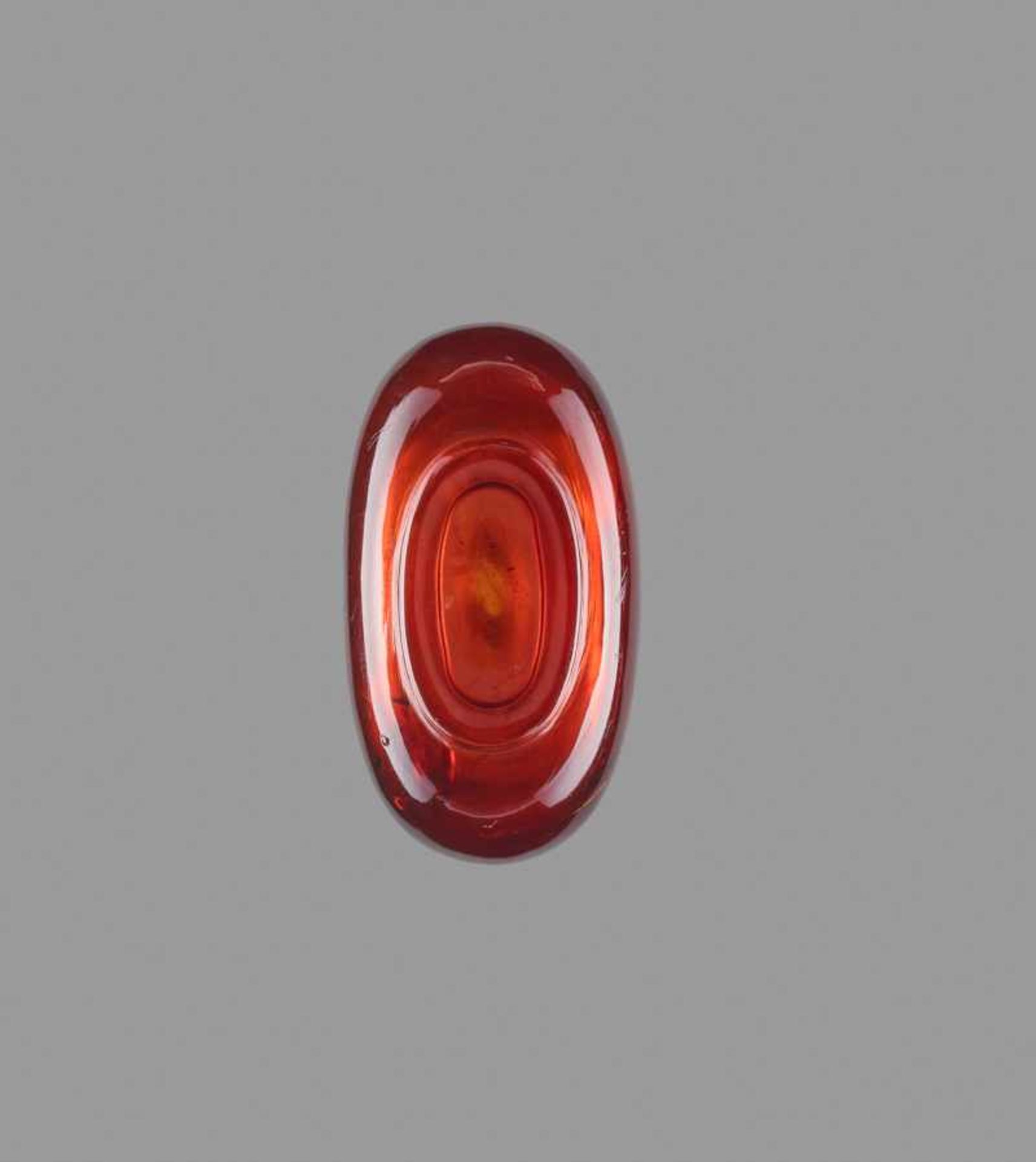 A SMALL PLAIN AMBER SNUFF BOTTLE Transparent amber of even golden-brown color, with a few smaller - Image 6 of 6