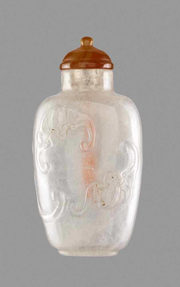 A ROCK CRYSTAL ‘BATS AND QILONG’ SNUFF BOTTLE, QING DYNASTY Clear rock crystal, with a cloudy ‘ice