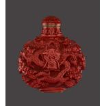 A CINNABAR LACQUER ‘DRAGON’ SNUFF BOTTLE Cinnabar lacquer in high relief on bronze body. China, late