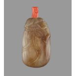 A CELADON AND RUSSET JADE ‘MONKEY AND SACK’ SNUFF BOTTLE Nephrite of celadon color with shades of