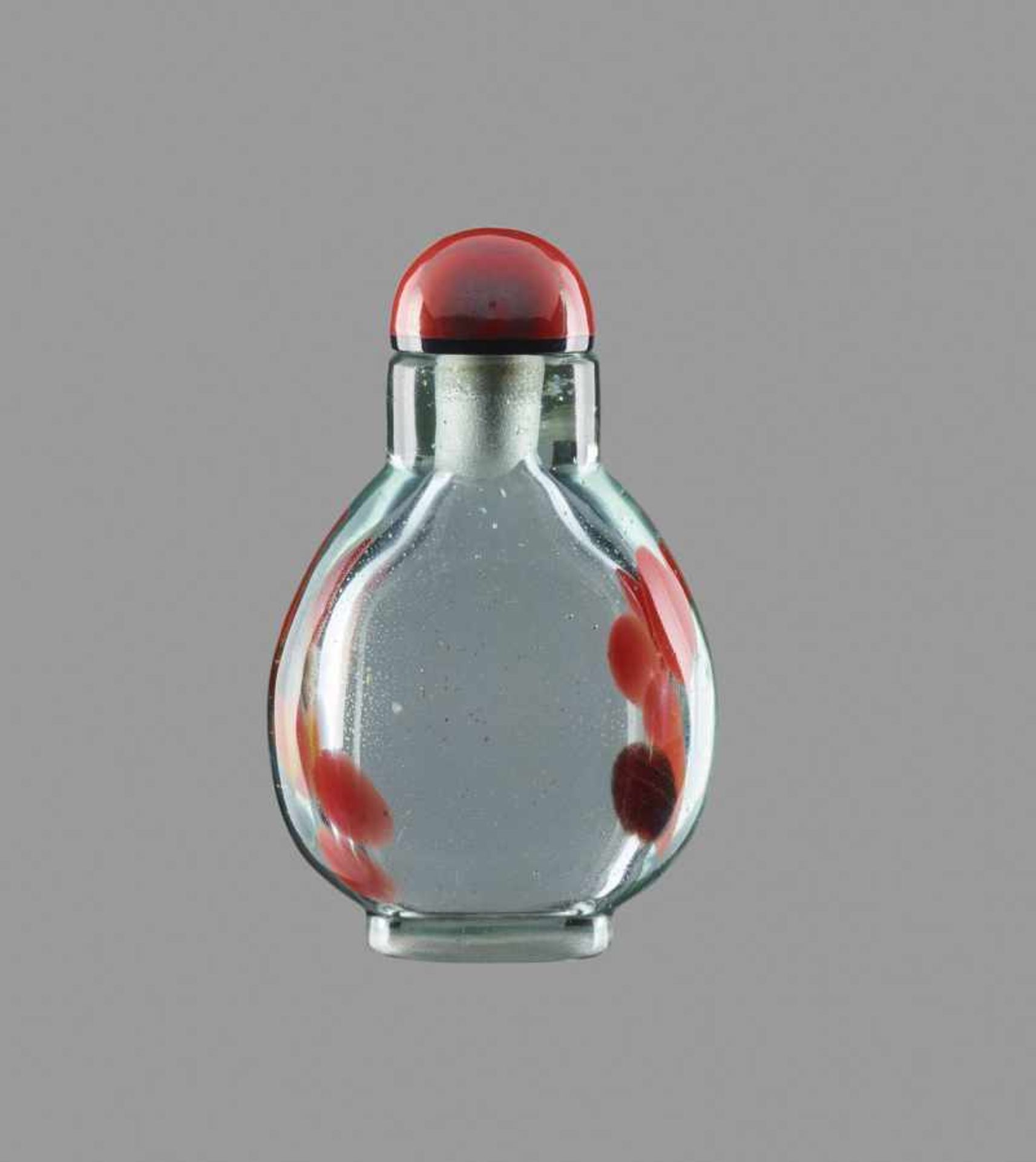 AN IRON-RED, YELLOW AND BROWN SANDWICHED AQUAMARINE GLASS SNUFF BOTTLE Bubble suffused glass body of