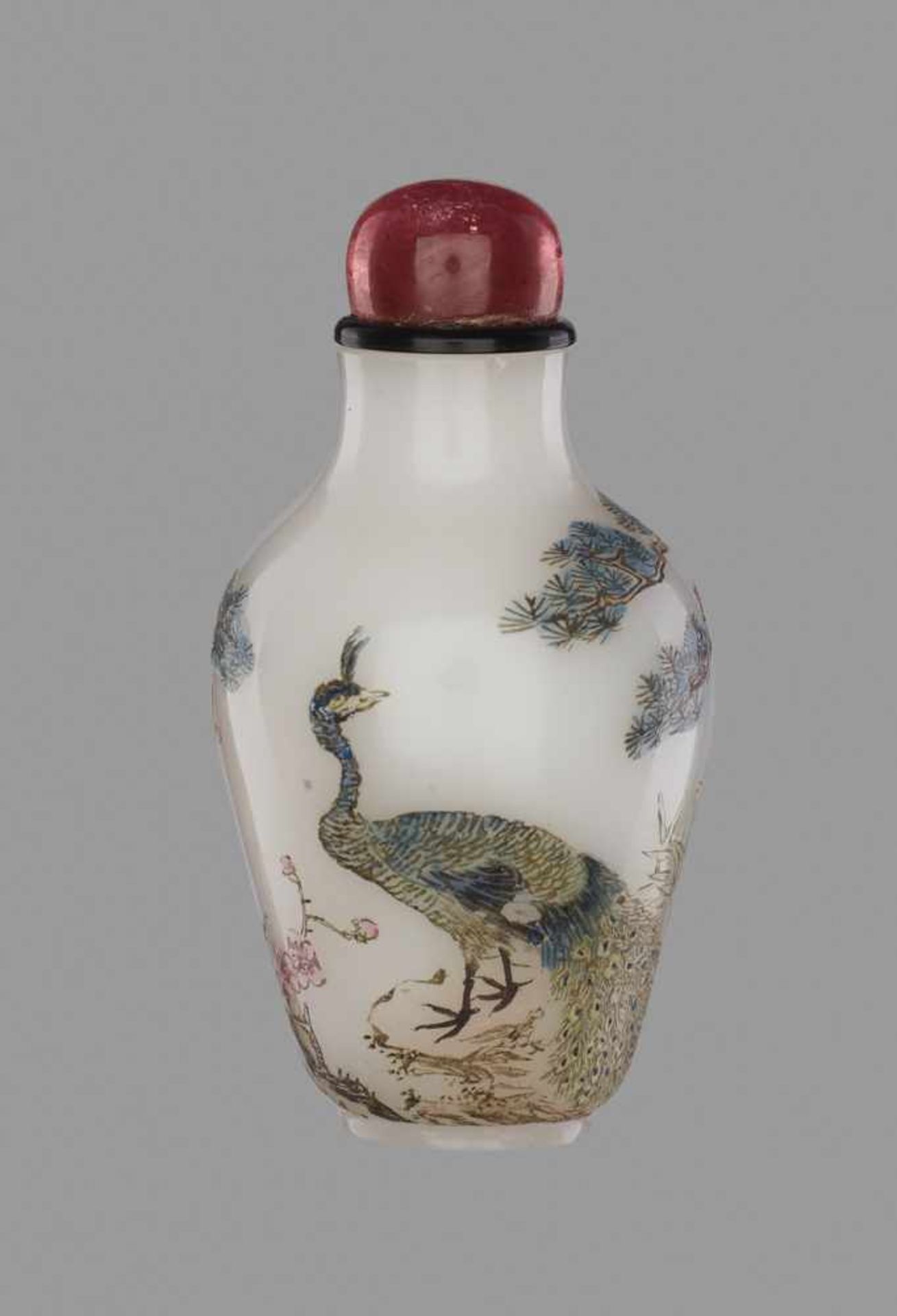 A GUYUE XUAN ‘PEACOCK’ ENAMELED GLASS SNUFF BOTTLE WITH A ‘PEACH’ MARK White opaque glass with