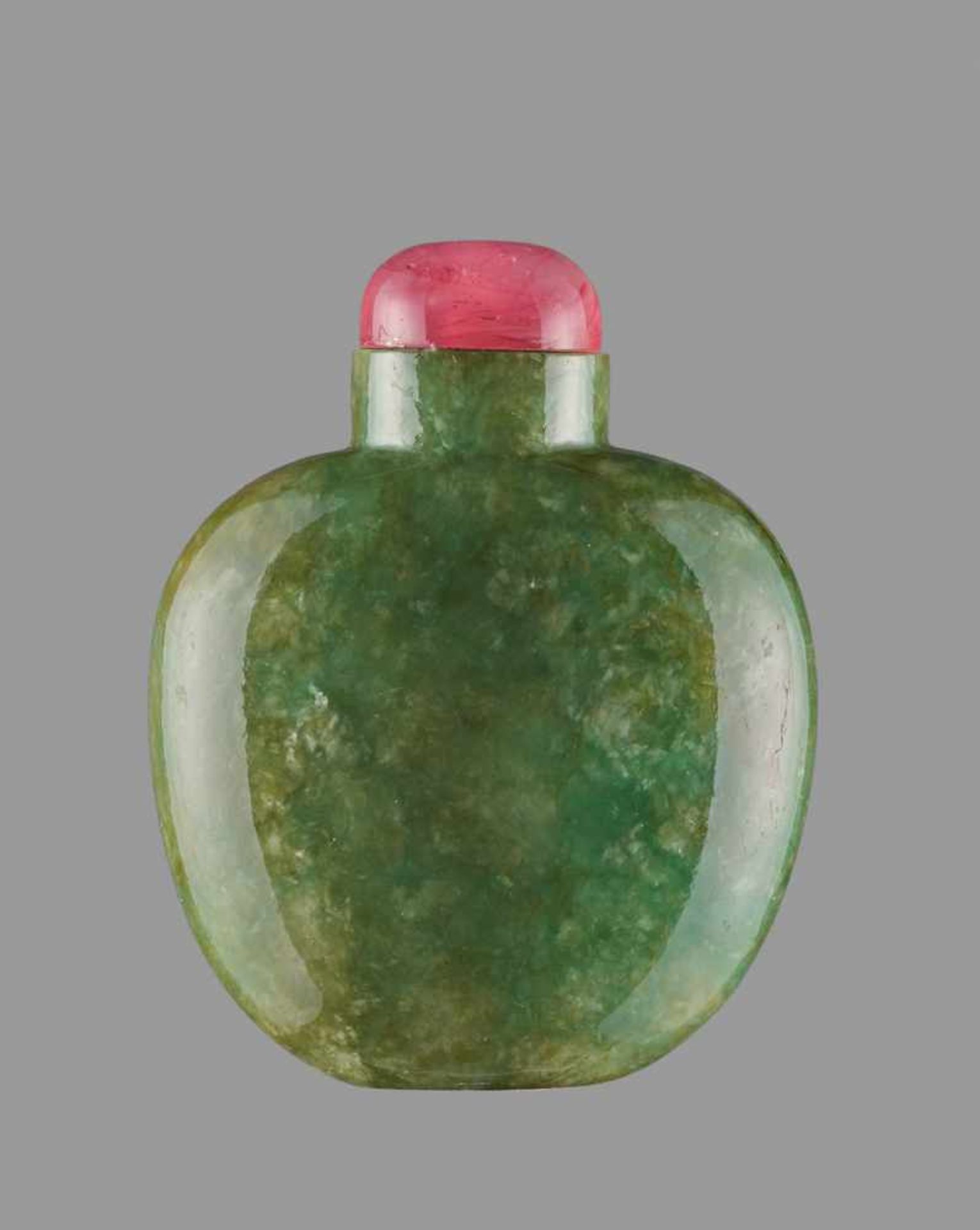 AN APPLE-GREEN JADEITE SNUFF BOTTLE WITH IRIDESCENT SILVERY STREAKS Mottled jadeite with a well-