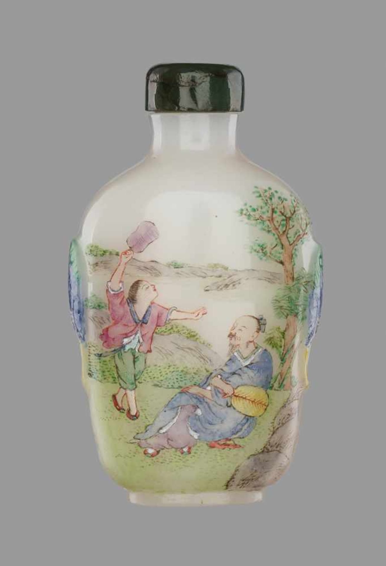 A ‘FAMILLE ROSE’ ENAMELLED AND CARVED WHITE GLASS GUYUE XUAN SNUFF BOTTLEMolded and carved opaque