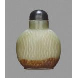 A CELADON AND RUSSET JADE 'BASKET-WEAVE' SNUFF BOTTLE Nephrite, of even celadon color with dark