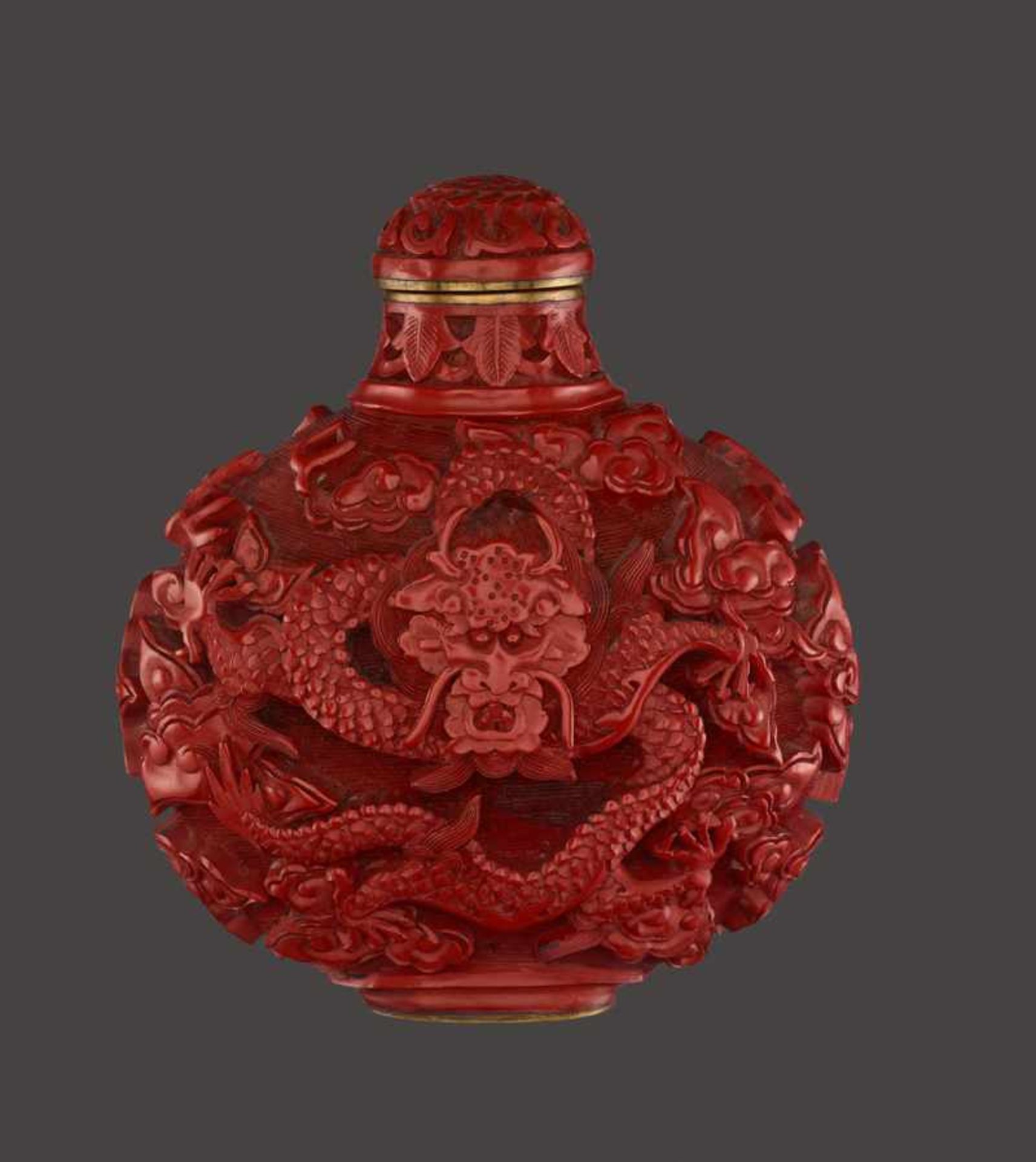 A CINNABAR LACQUER ‘DRAGON’ SNUFF BOTTLE Cinnabar lacquer in high relief on bronze body. China, late - Image 2 of 6