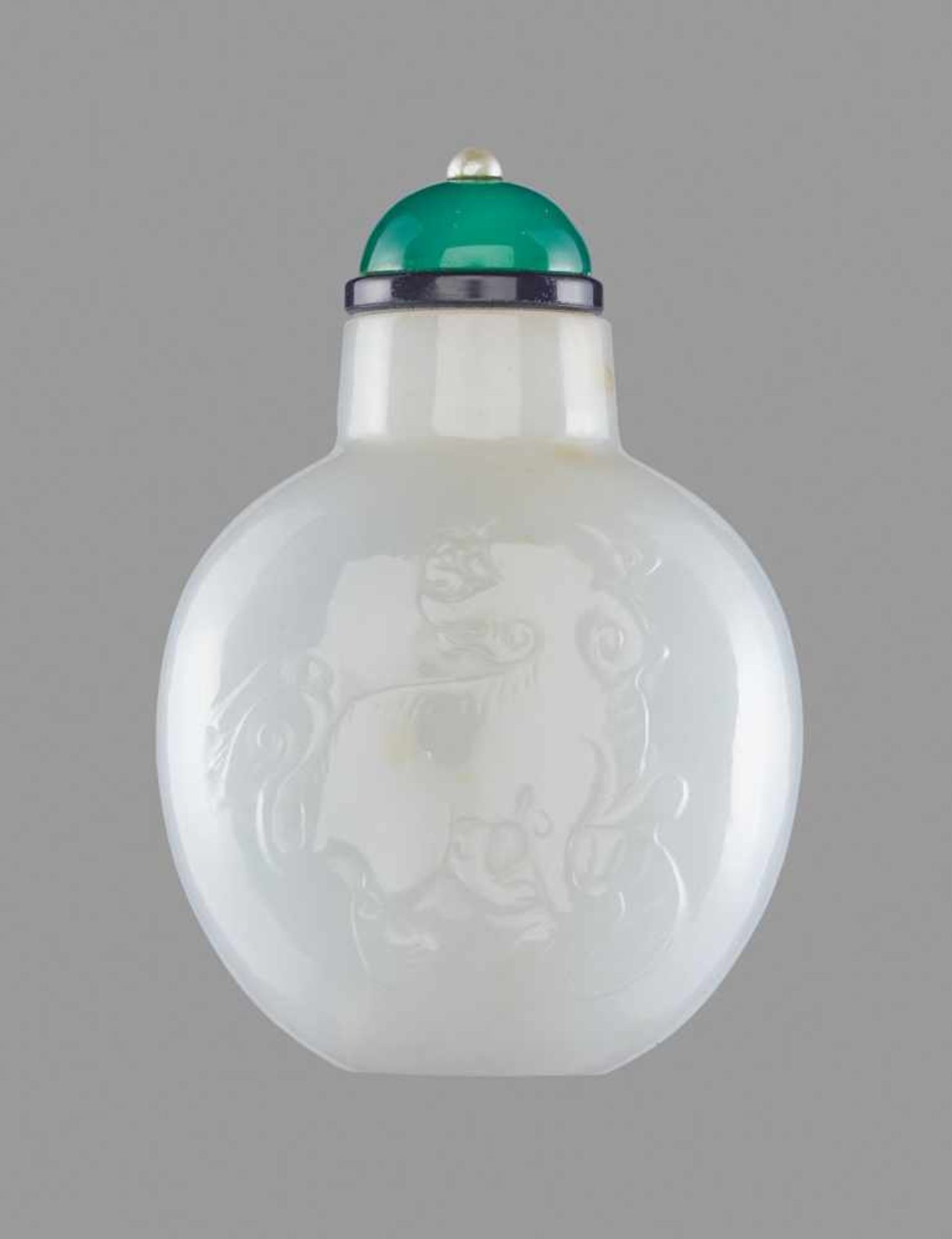 A WHITE JADE 'GUARDIAN LION' SNUFF BOTTLE, QING DYNASTY, 1780-1880 White jade, with smooth surface