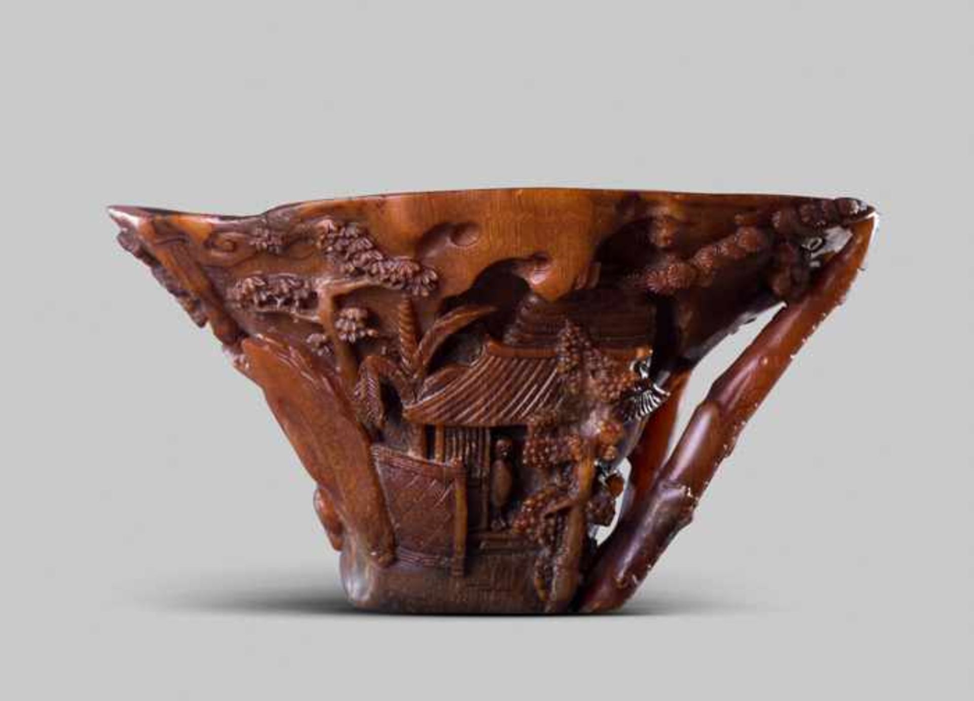 A SIGNED RHINOCEROS HORN 'LANDSCAPE' LIBATION CUP, SCHOOL OF ZHOU WENSHU, 17TH CENTURY The horn of - Image 2 of 5