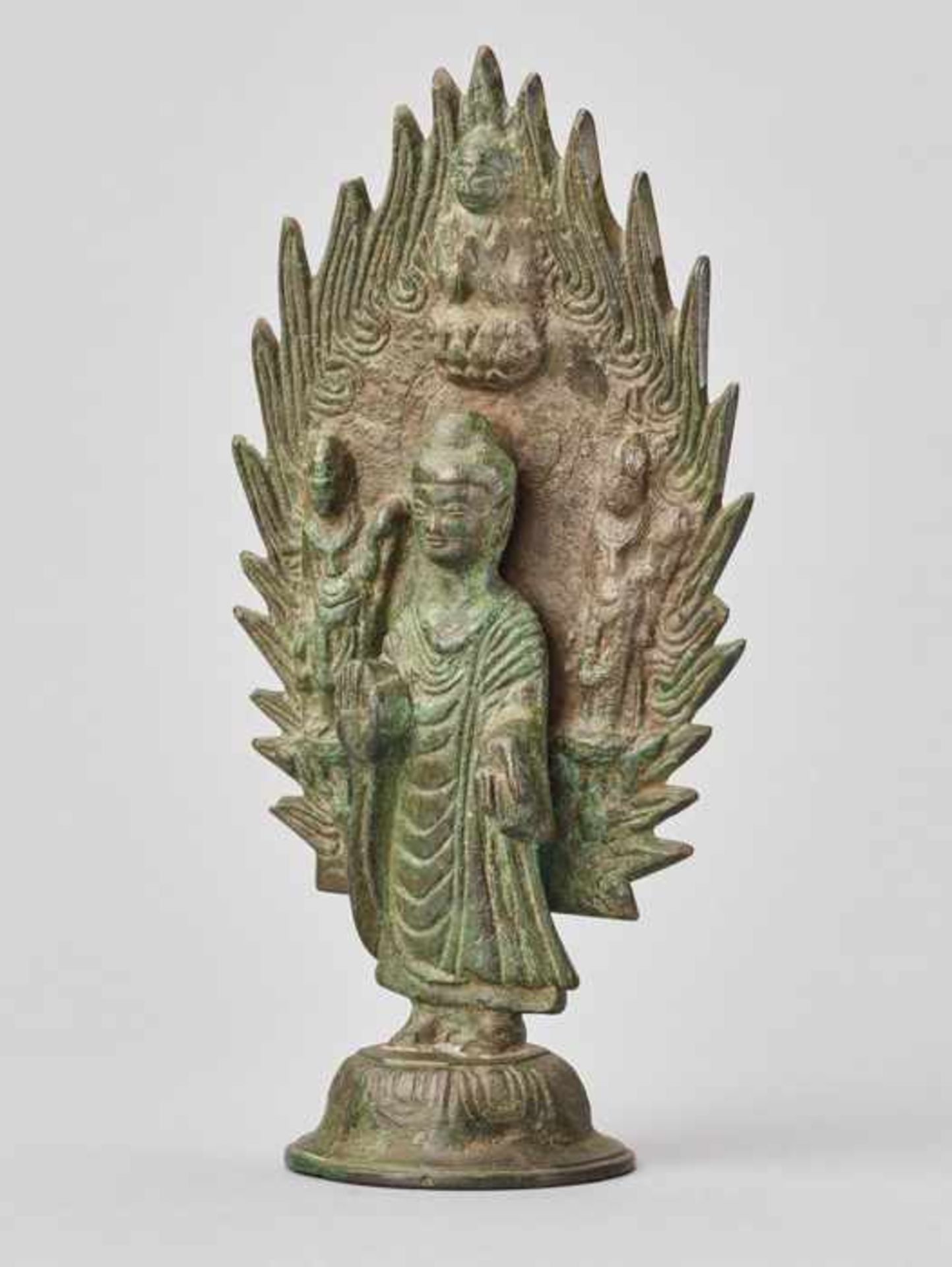 BUDDHA STANDING IN FRONT OF A FLAMING HALO, BRONZE, CHINA, DATED 571 Cast and incised bronze with