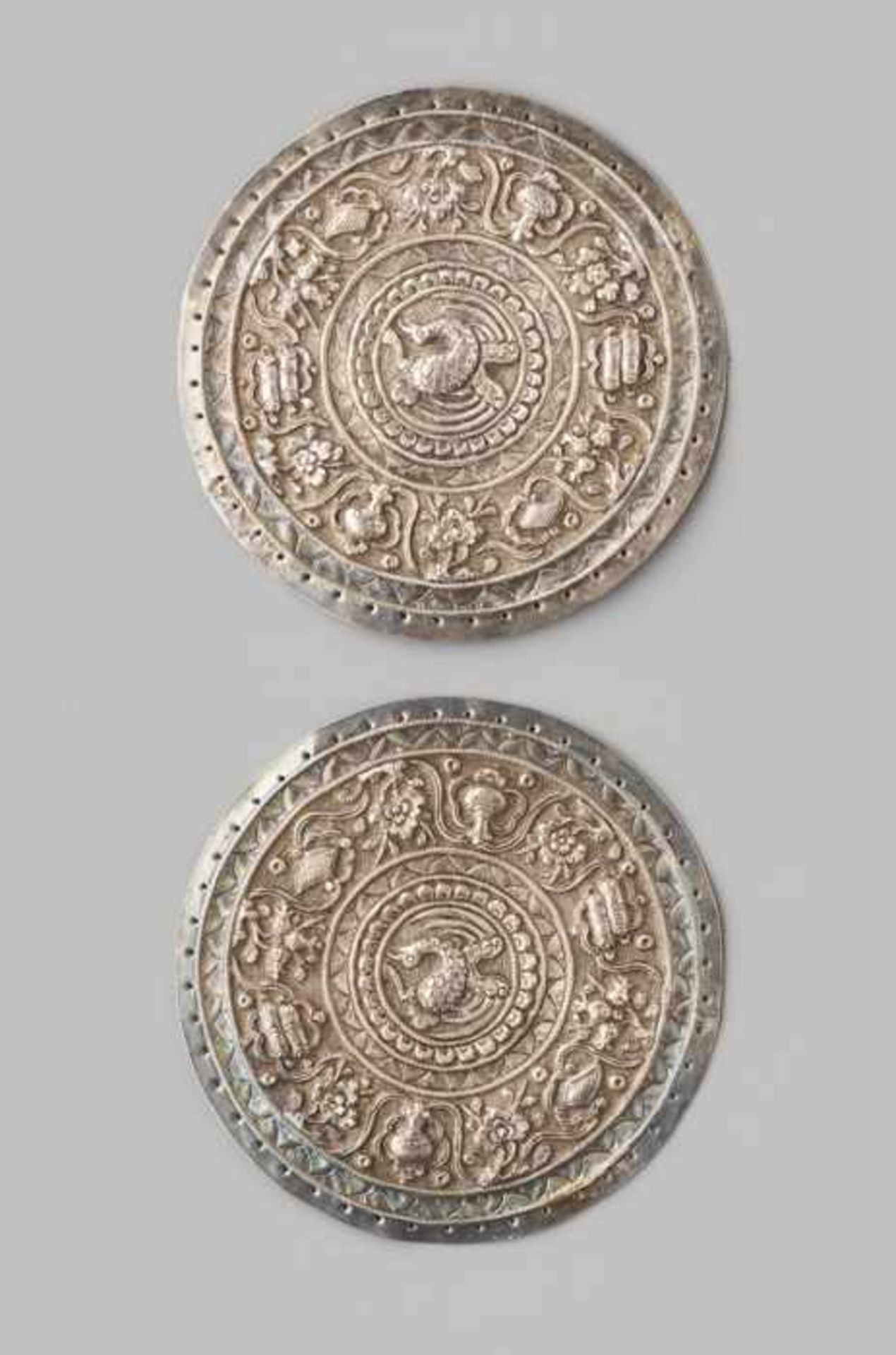 A PAIR OF BUDDHIST SILVER REPOUSSÉ EMBLEMS, QING DYNASTY Silver. China, 18th-19th centuryBoth