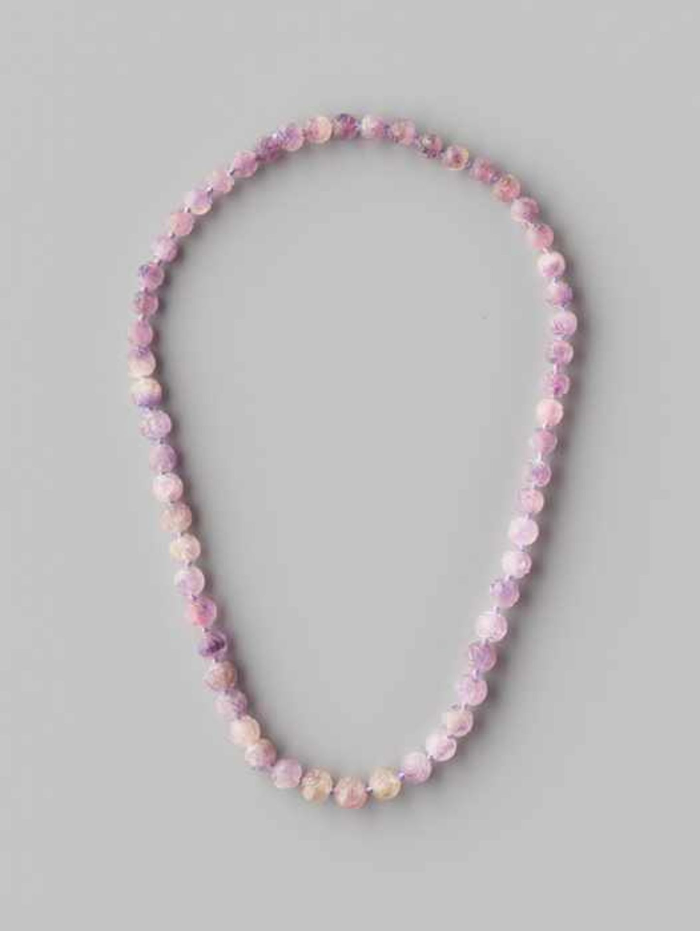 AN AMETHYST BEAD ‘SHOU’ NECKLACE, 56 BEADS, QING DYNASTY The amethyst beads with varying colors from