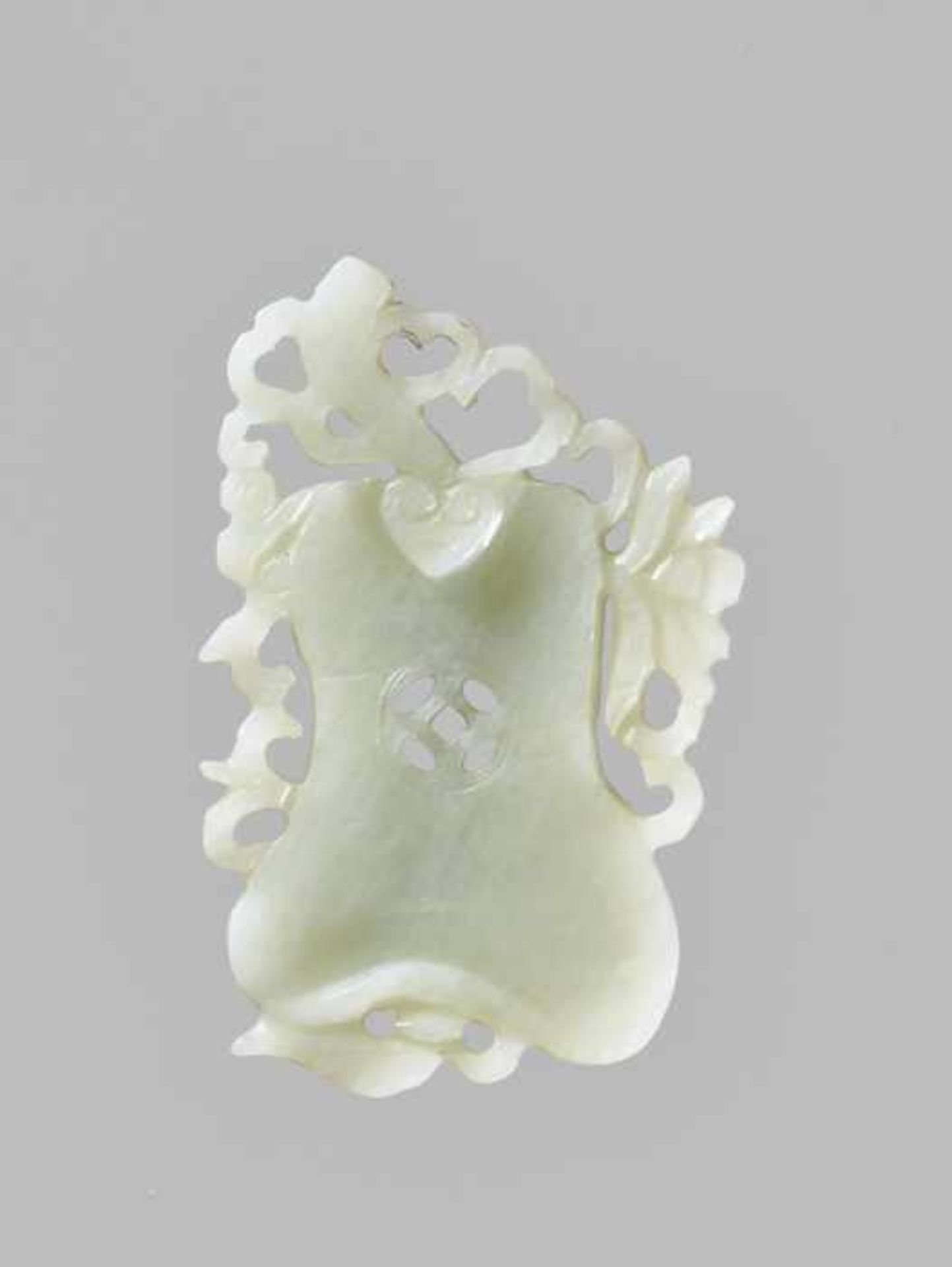 A WHITE JADE ‘GOURD’ PENDANT, QING DYNASTY Semi-translucent celadon-white jadeite. China, late