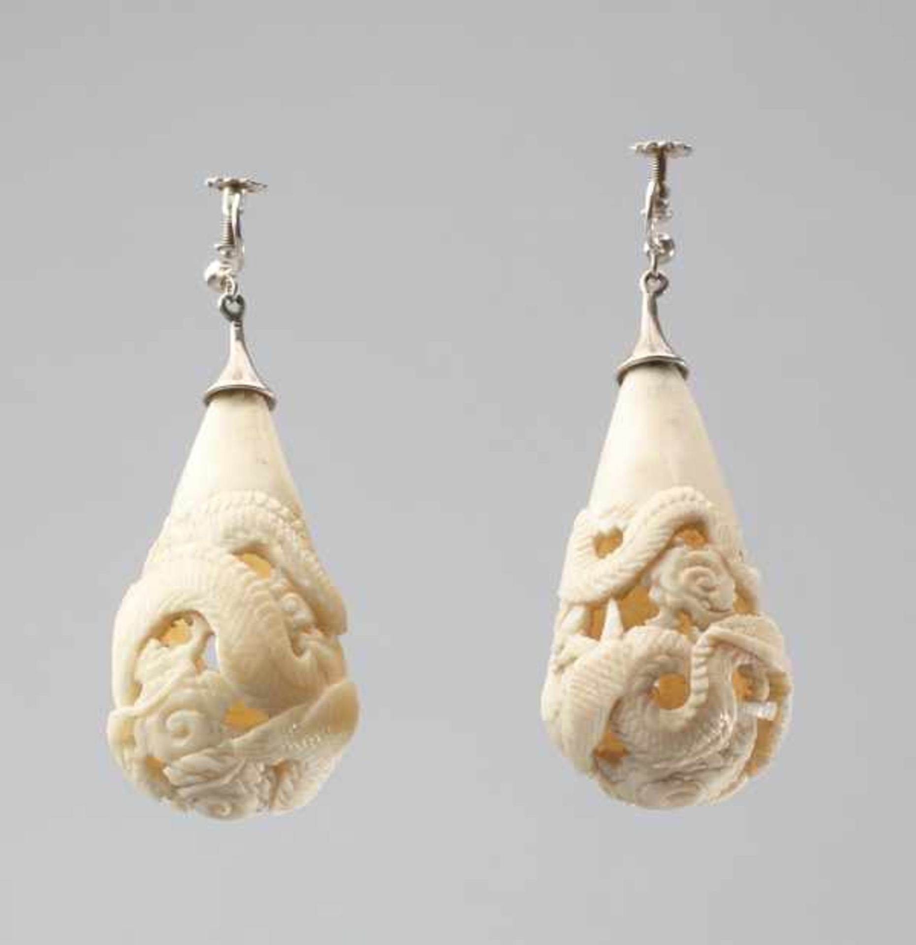 A PAIR OF CARVED IVORY DRAGON EARRINGS, 1920s Ivory with mother of pearl inlaid eyes, worked in - Image 3 of 4