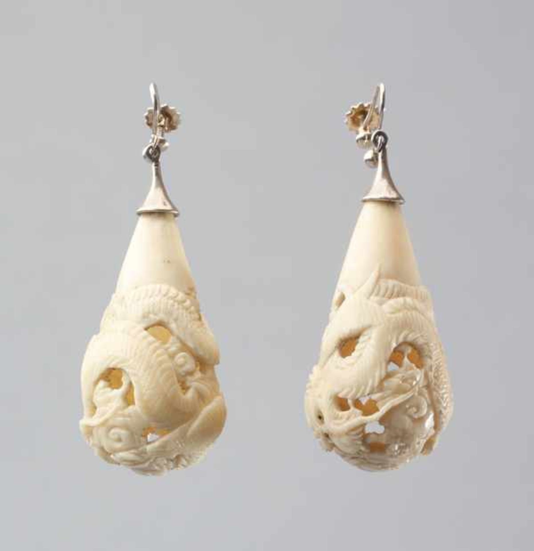 A PAIR OF CARVED IVORY DRAGON EARRINGS, 1920s Ivory with mother of pearl inlaid eyes, worked in - Image 2 of 4