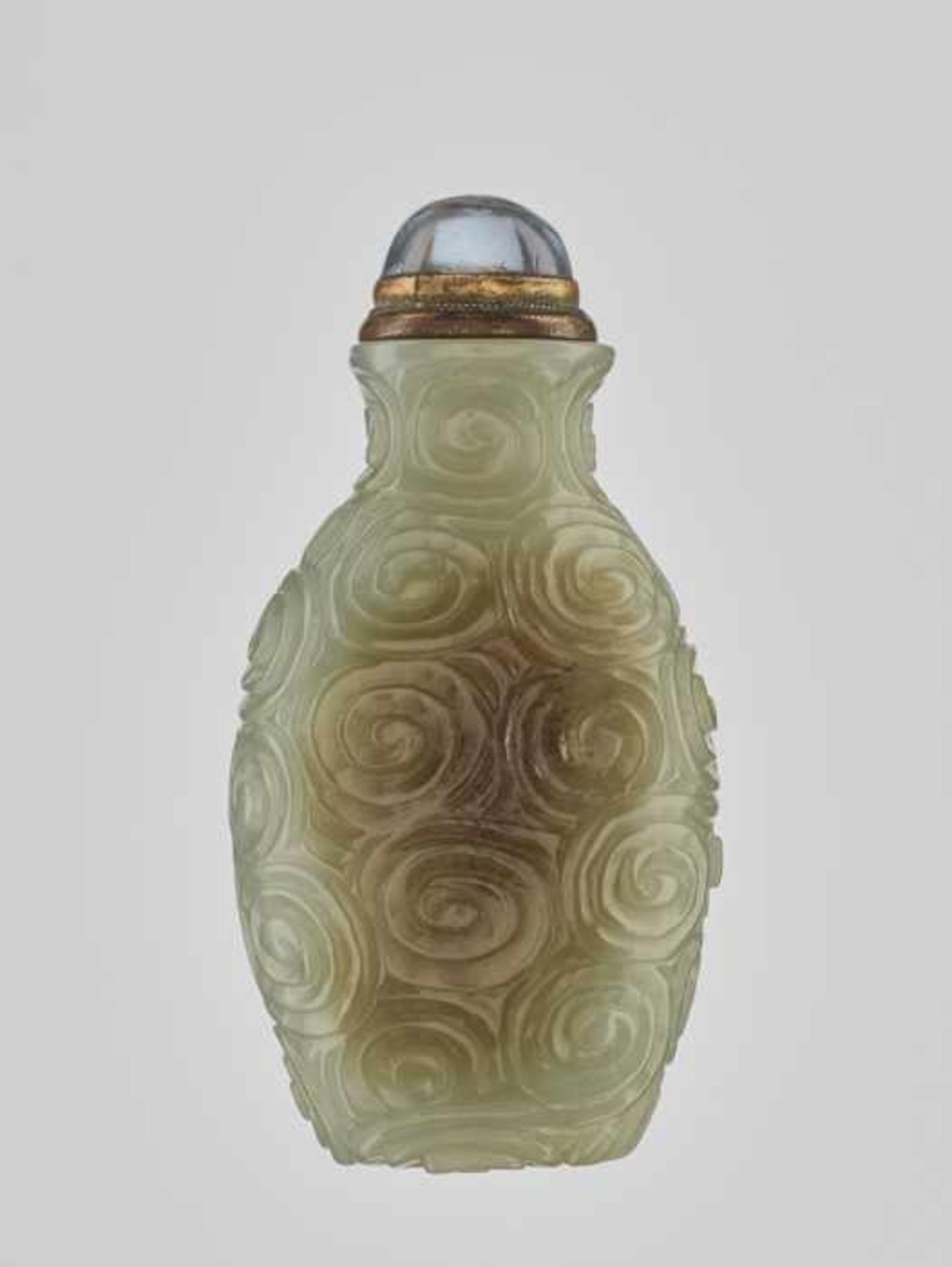 A CELADON JADE ‘SPIRAL’ SNUFF BOTTLE, 19th CENTURY Massive and heavy nephrite of even, almost