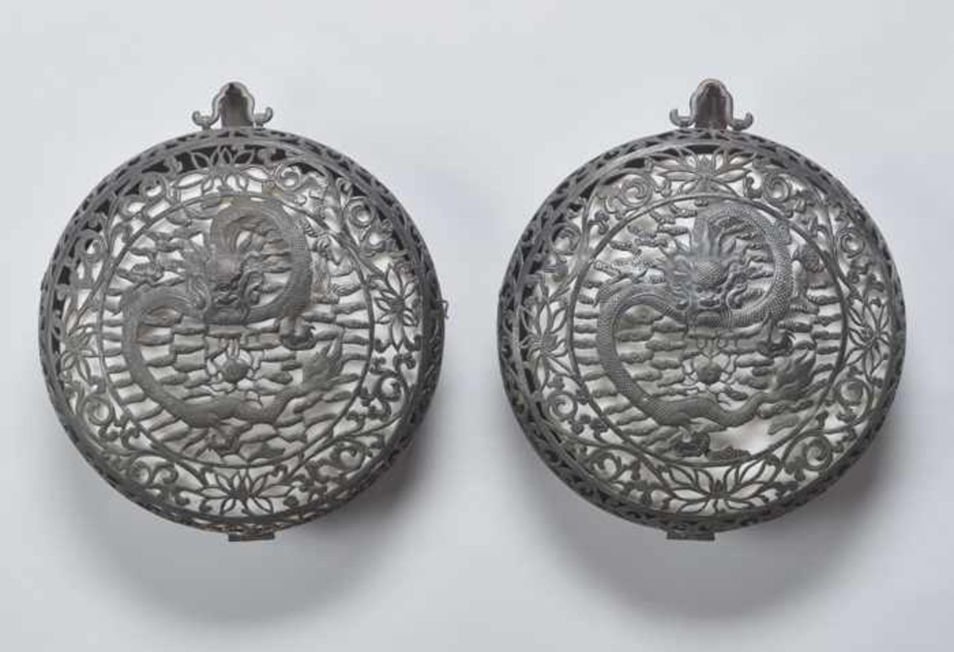 A PAIR OF “DRAGON” BRONZE LANTERNS, QING DYNASTY Thin sheet bronze. Reticulated. Cut, embossed and