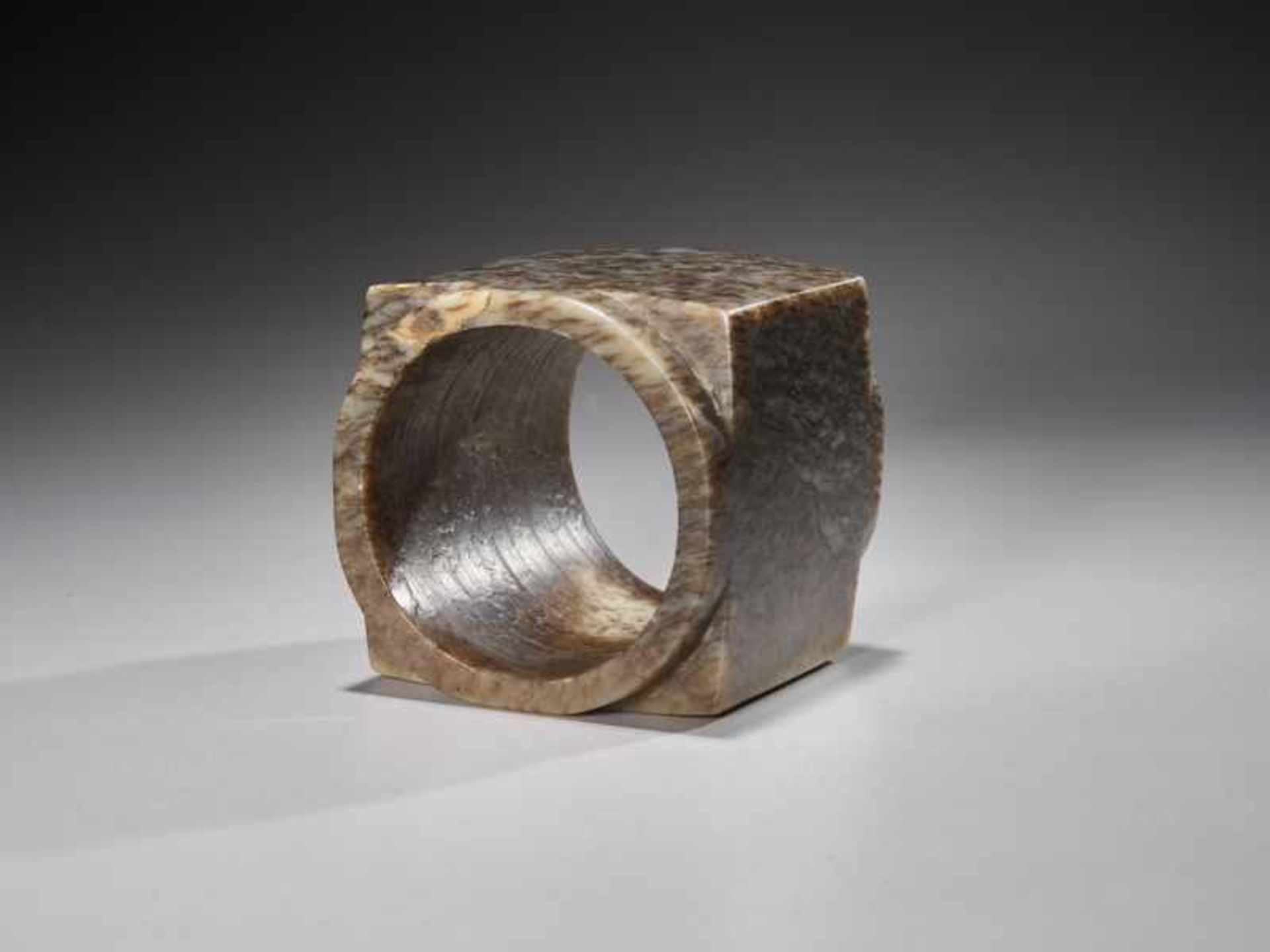 A SUPERB CUBE-SHAPED CONG WITH FINELY POLISHED SIDES CARVED FROM MOTTLED BROWN JADE Jade. China, - Image 5 of 6