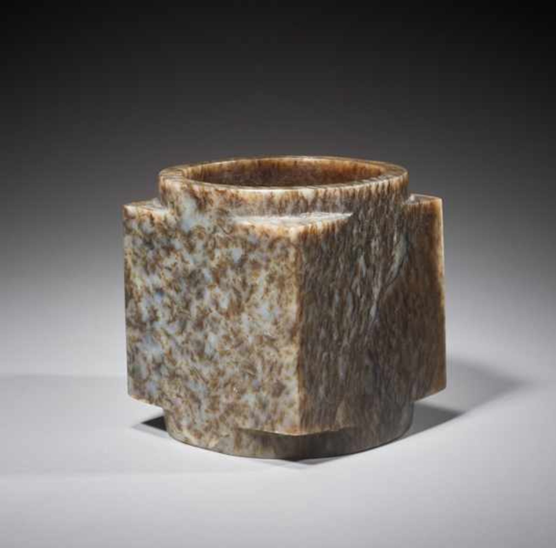 A SUPERB CUBE-SHAPED CONG WITH FINELY POLISHED SIDES CARVED FROM MOTTLED BROWN JADE Jade. China,